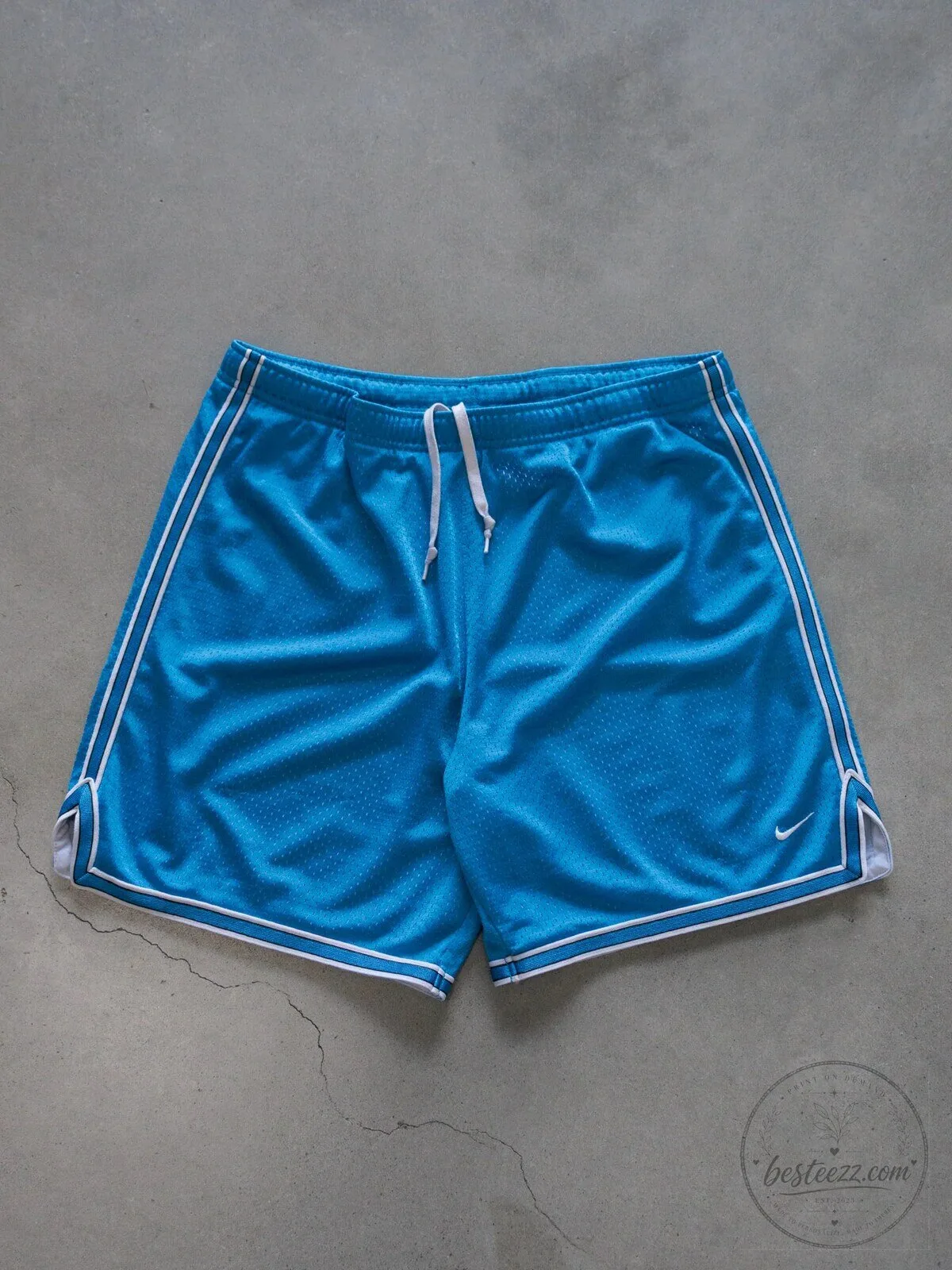 Vintage Nike Blue Mesh Athletic Shorts with White Trim for Women
